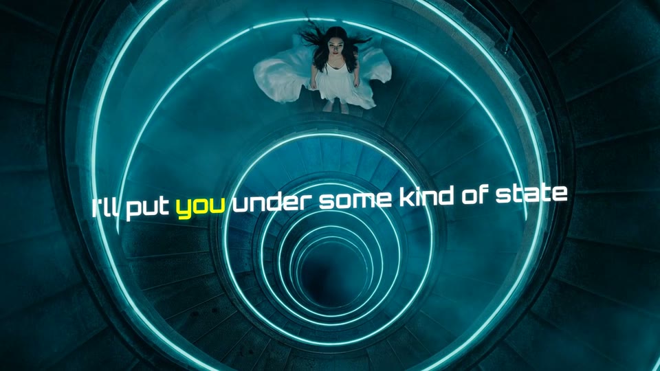 A cinematic spiral of blue light in a lyric video study