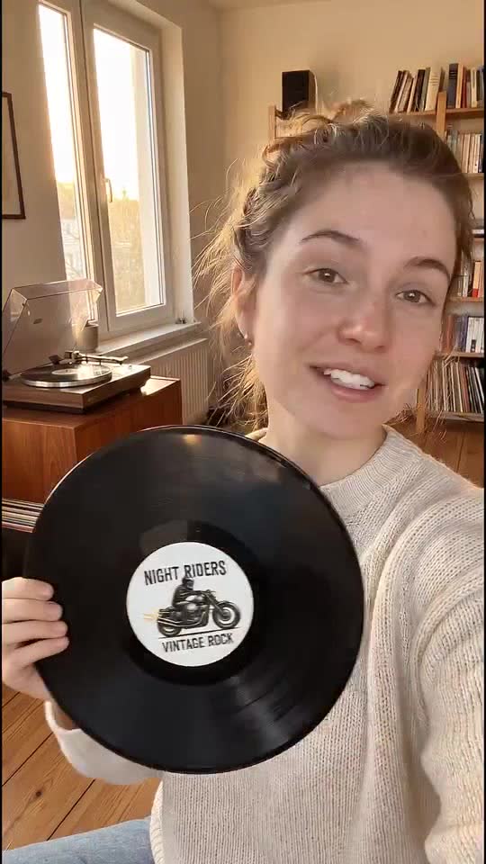 A creator-style promotional clip with a vinyl record